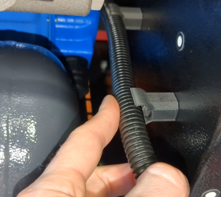 Bespoke fitted bracket inside compressor
